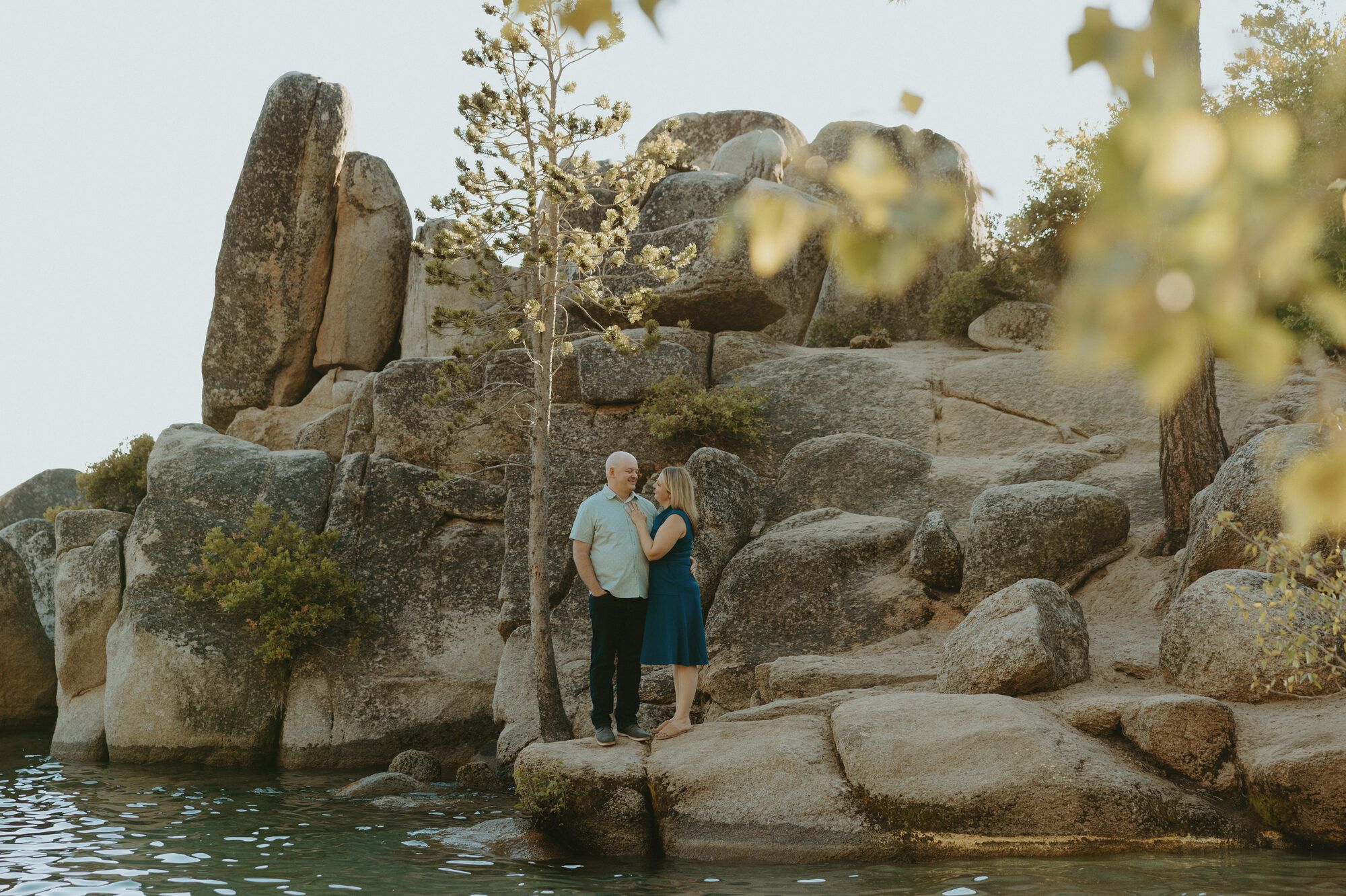Nicole and Eric among dramatic granite outcrops above the lake